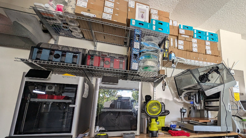 Workshop or garage with tools, equipment, and supplies on shelves and counters.