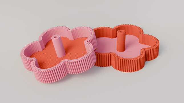 Two flower-shaped incense holders, one pink and one red, on a light gray background.